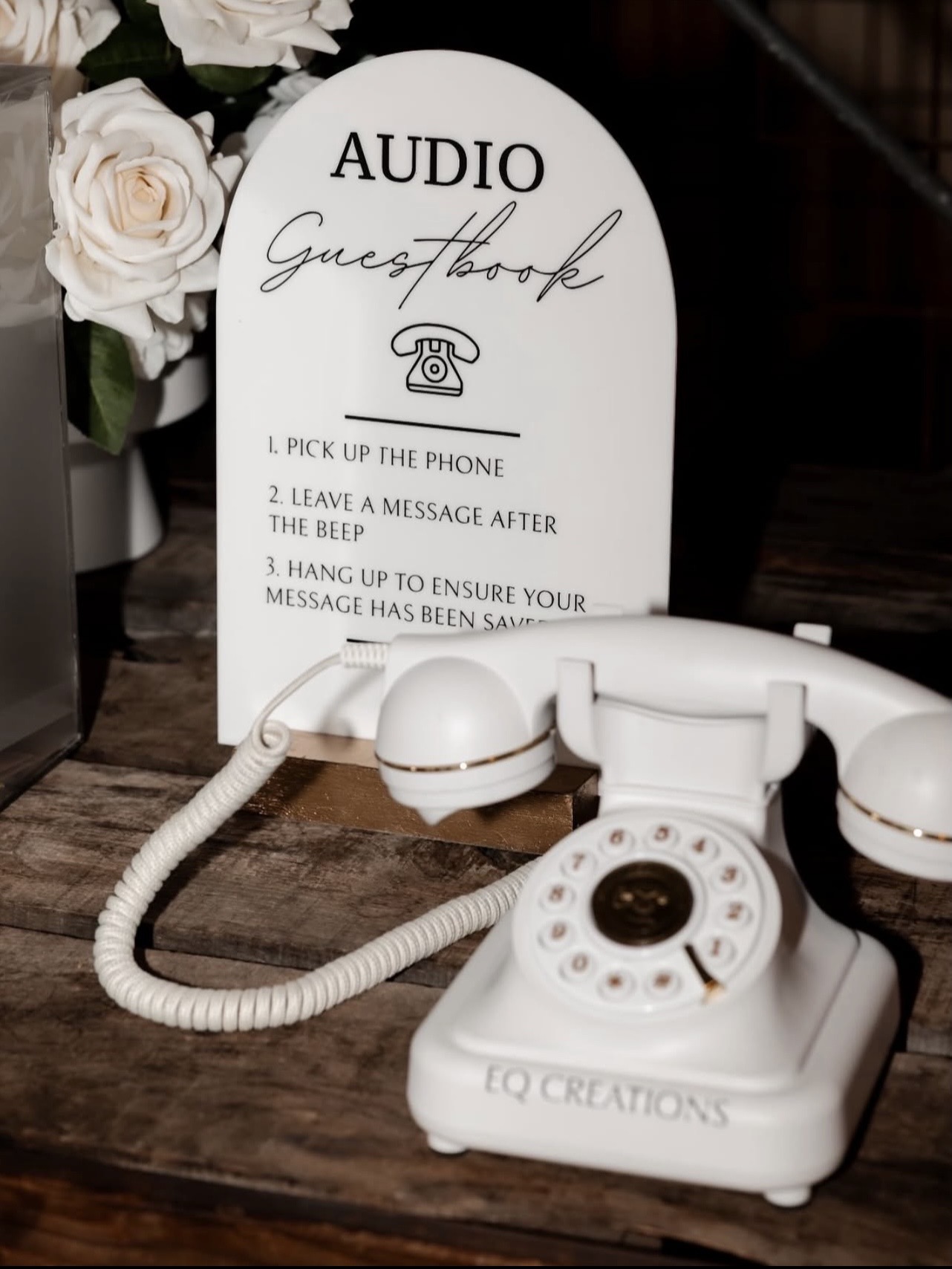Vintage-style audio guestbook phone with instruction sign